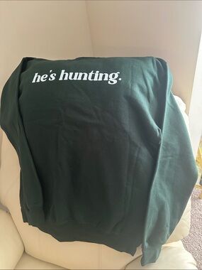 Who’s Hunting…get comfy in this money green Gildan sweatshirt, always on trend.